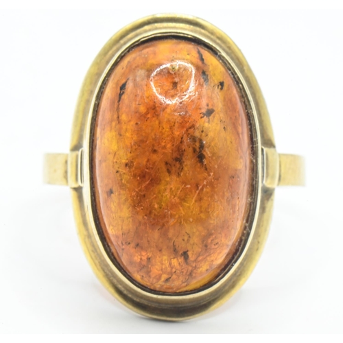 43 - 8ct gold and oval cabochon amber ring, stamped 333, size Q1/2, gross weight 3 grams