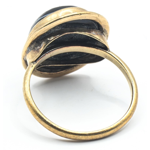 46 - Yellow metal and banded agate ring, tests positive for 9ct gold, size N1/2, gross weight 4.1 grams