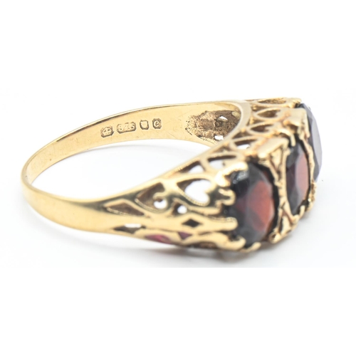 48 - 9ct gold and three stone garnet ring, hallmarked London 1977, size O1/2, gross 2.82 grams