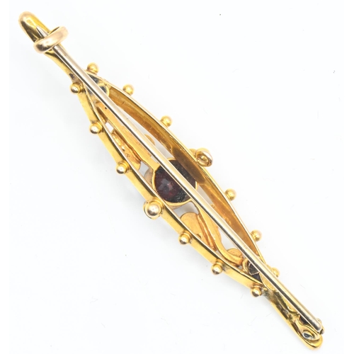 59 - 15ct gold, garnet and seed pearl brooch, partial hallmark, length 51mm, with base metal pin, gross w... 