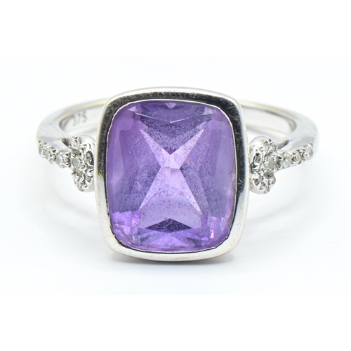 62 - 9ct white gold, amethyst and diamond ring, the amethyst measuring approximately 12mm x 9mm in a rub ... 