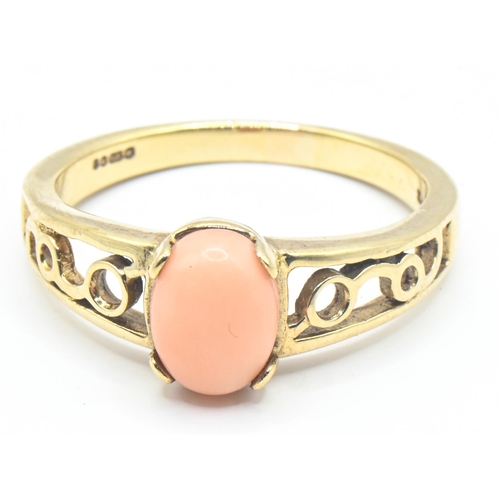 92 - 9ct gold ring with openwork shoulders set with an oval shaped coral, size P1/2, gross weight 3.13 gr... 