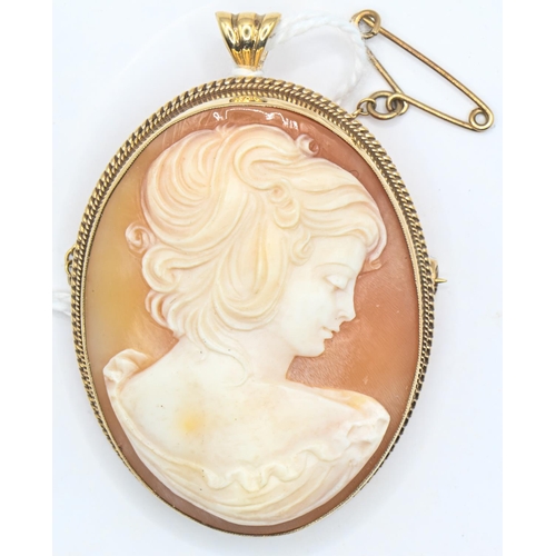 110 - 9ct gold mounted carved shell cameo pendant/brooch, with safety chain, 50 x 35mm including bale, gro... 