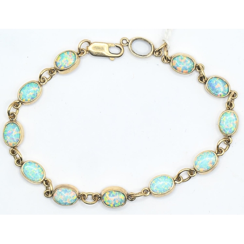 113 - 9ct gold and eleven opal bracelet, length 380mm, gross weight 8.82 grams