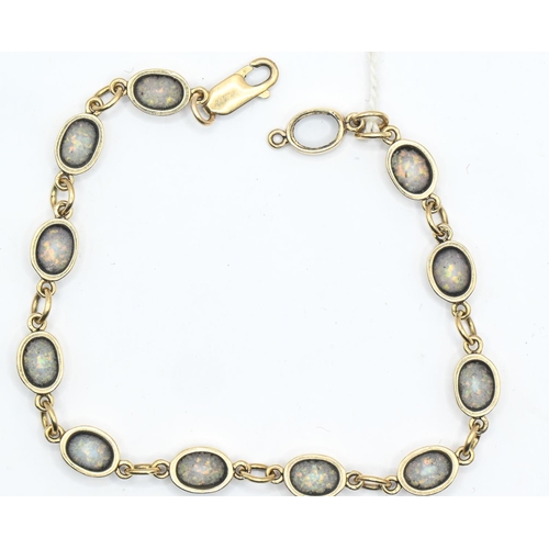 113 - 9ct gold and eleven opal bracelet, length 380mm, gross weight 8.82 grams