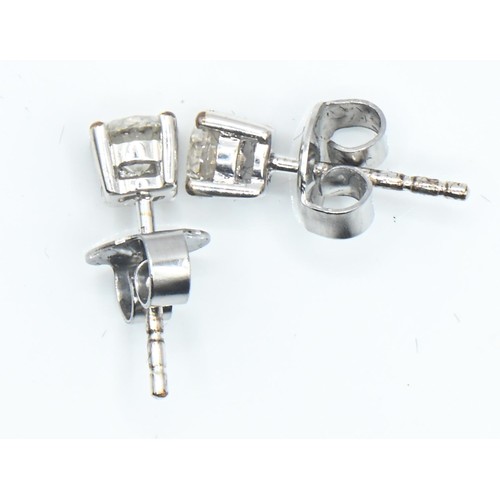 8 - Pair of 18ct white gold and diamond ear studs, the diamonds together weighing approximately 0.50 car... 