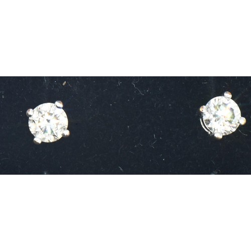 8 - Pair of 18ct white gold and diamond ear studs, the diamonds together weighing approximately 0.50 car... 