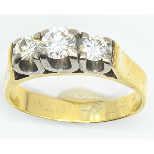 12 - 18ct gold and three stone diamond ring, the diamonds together weighing approximately 0.66 carat, siz... 