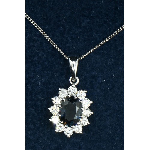 61 - 18ct white gold, sapphire and diamond cluster pendant, together with a 9ct white gold neck chain, le... 