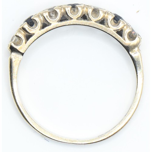 71 - 18ct gold, diamond and sapphire half hoop ring, size O, gross weight 2.7 grams