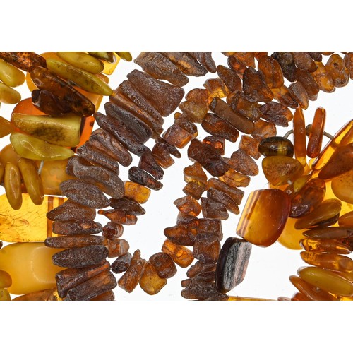 238 - Collection of three bracelets and two necklaces in rough cut amber, gross weight 140 grams