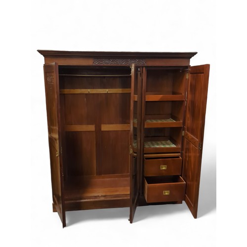 636 - Large mahogany triple wardrobe with central mirror. W178cm, D56cm, H199cm.