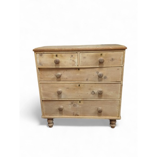 638 - Stripped pine 2 over 3 chest of drawers. On small, turned legs. Locks in each drawer but no key. W93... 