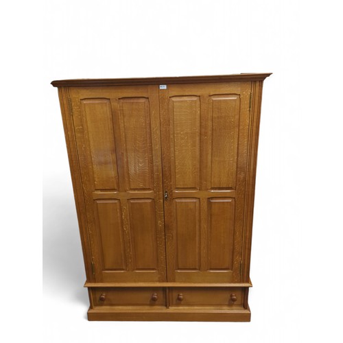 639 - Large double wardrobe with 2 lower drawers. Lock and key present. W128cm, D65cm, H180cm.