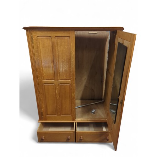 639 - Large double wardrobe with 2 lower drawers. Lock and key present. W128cm, D65cm, H180cm.