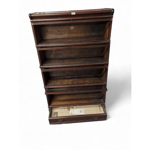 654 - Globe Wernicke 4-sectioned glazed fronted book shelves with lower drawer. W87cm, D31cm, H147cm.