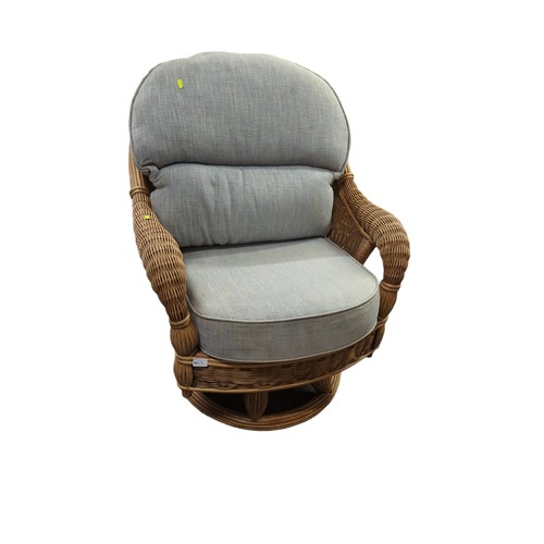 679 - Wicker swivel chair with upholstered cushions. W83cm, D approx. 83cm, H96cm.