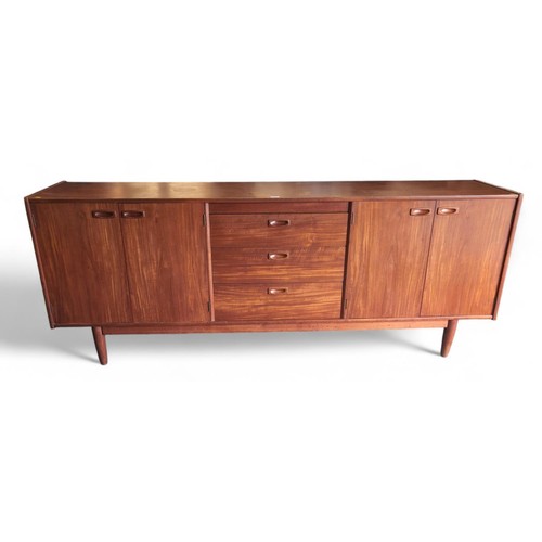 690 - Large, teak, Younger mid-century sideboard. 3 central drawers and 2 outer cupboards. L213cm, D36cm, ... 