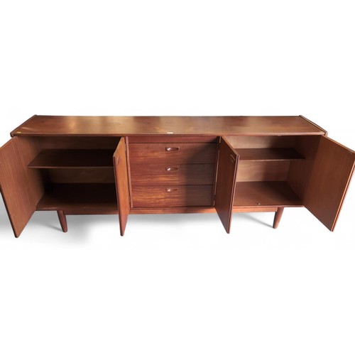 690 - Large, teak, Younger mid-century sideboard. 3 central drawers and 2 outer cupboards. L213cm, D36cm, ... 