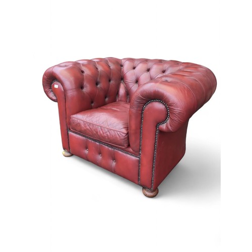 700 - Red leather Chesterfield style tub chair. W123cm D90cm H76cm