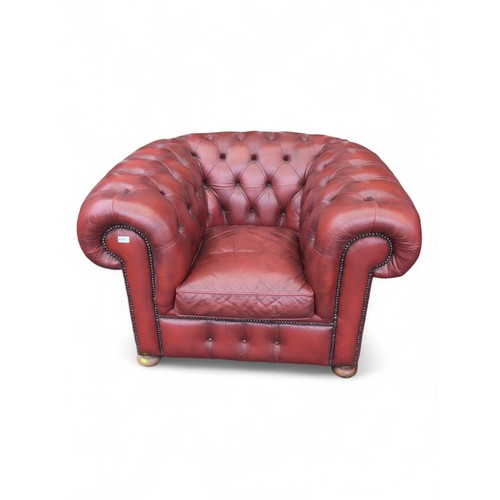 700 - Red leather Chesterfield style tub chair. W123cm D90cm H76cm