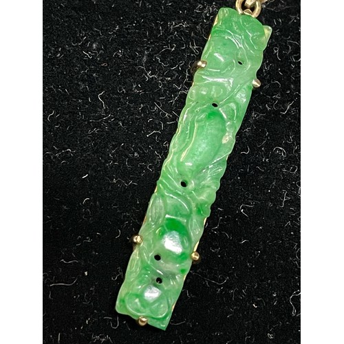 1 - Carved jade pendant claw mounted onto 9ct gold with a 9ct gold chain, pendant length 35mm, chain len... 