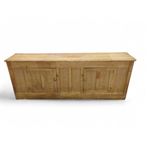 684 - Large strip pine dresser bottom/sideboard. W224cm, D44cm, H85cm.