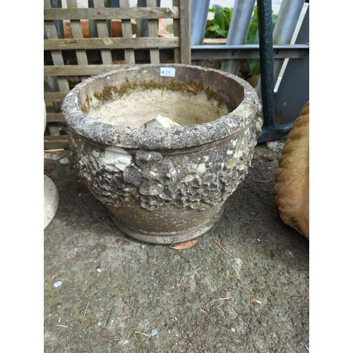 29 - Flower adorned concrete garden planter. H32cm D40cm