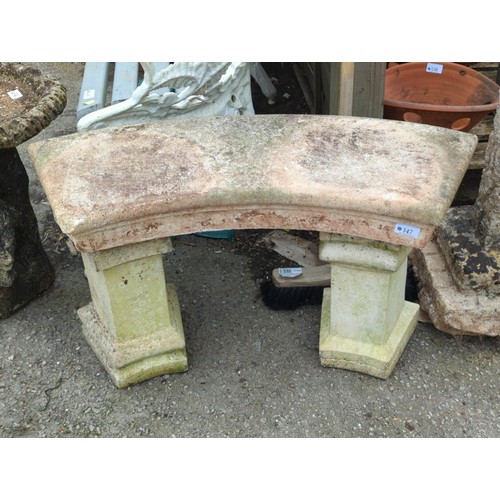 147 - Small sandstone effect crescent seated garden seat. W79cm