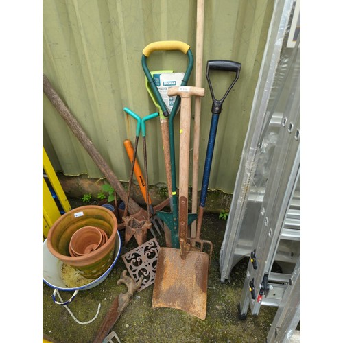 66 - Quantity of long handled tools inc. Spades, forks