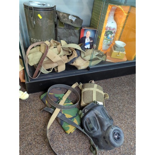 1257 - Military items inc. flask, gas mask, canvas utility bags, canteen, Winston Churchill tin etc.