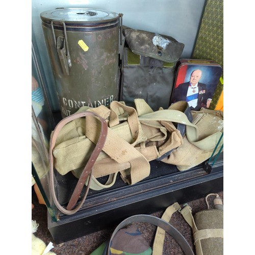 1257 - Military items inc. flask, gas mask, canvas utility bags, canteen, Winston Churchill tin etc.