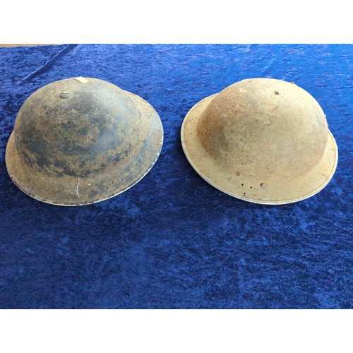 1281 - Two metal military helmets 