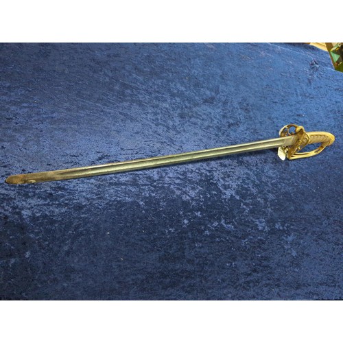 1303 - Victorian 1845 pattern officer's sword, the blade with floral decoration with crown and (worn) ... 