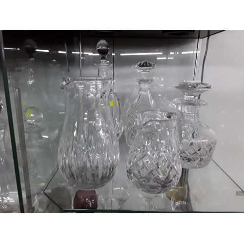 1229 - Three crystal decanters and two jugs inc. Royal Doulton