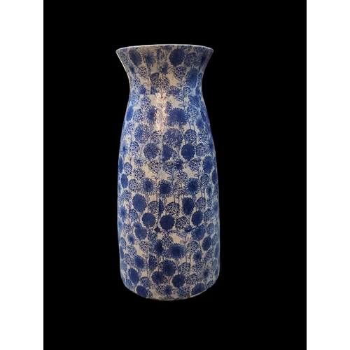 560 - Impressive very large blue & white glazed terracotta vase, with floral decoration. H80cm