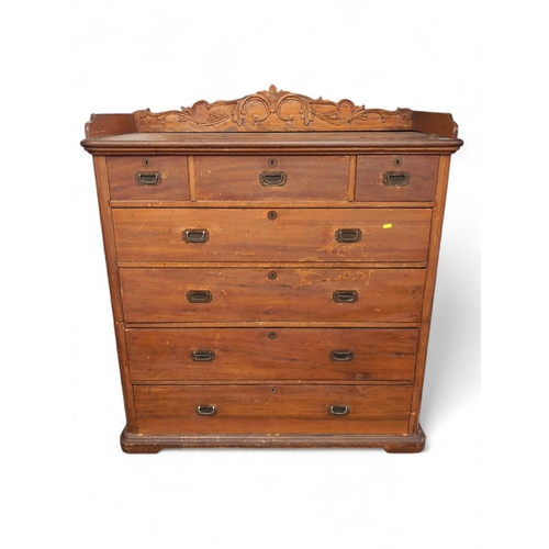 534 - Late C19 Camphor wood 2-part campaign chest of drawers, with top carved back, 7 variously sized draw... 