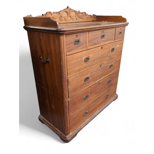 534 - Late C19 Camphor wood 2-part campaign chest of drawers, with top carved back, 7 variously sized draw... 