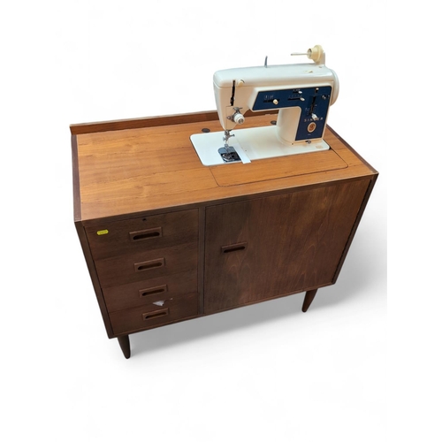 511 - Singer 656G electric sewing machine in mid-century style work table with cupboard & 4 shelves. W... 