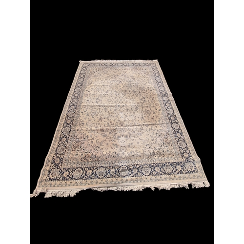 504 - Large Turkish style wool rug. 350cm x 250cm. Would benefit from odour treatment.