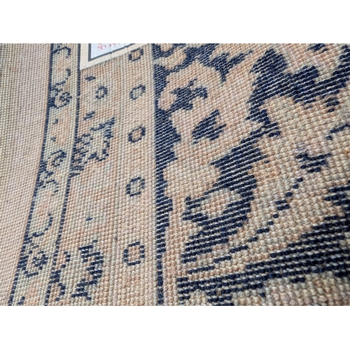 504 - Large Turkish style wool rug. 350cm x 250cm. Would benefit from odour treatment.