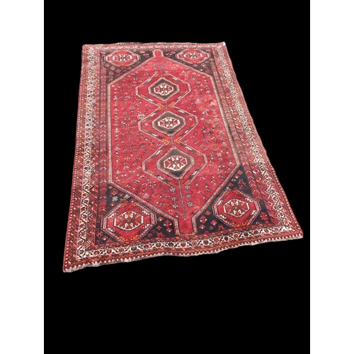 508 - Hand knotted Shiraz rug. W225cm L327cm