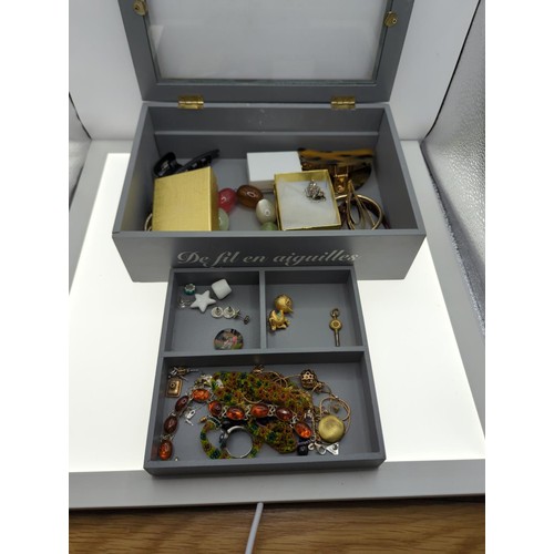 85 - Grey box part filled with costume jewellery Inc Harrypotter earrings, hair clips, bracelets Etc.