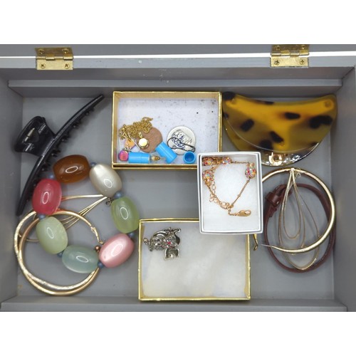 85 - Grey box part filled with costume jewellery Inc Harrypotter earrings, hair clips, bracelets Etc.