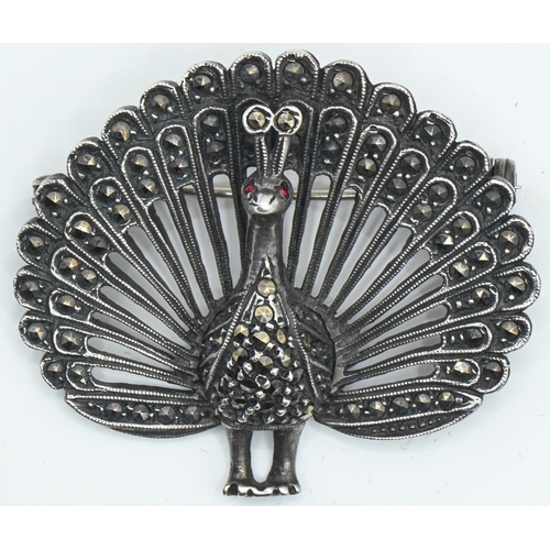 73 - Silver and marcasite peacock brooch, width 44mm, gross weight 20 grams