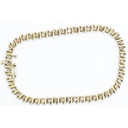 39 - 10ct gold and diamond line bracelet, with S-shape gold spacers, length 190mm, gross weight 7.48 gram... 