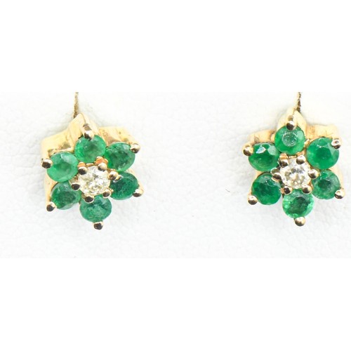 43 - Pair of 18ct gold, emerald and diamond flowerhead ear studs, diameter 8mm, gross weight 3.25 grams