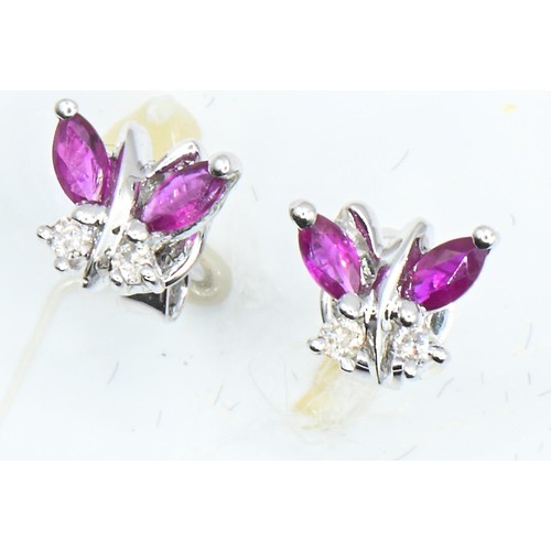 45 - Pair of 18ct white gold, ruby and diamond 'butterfly' ear studs, width 7mm, gross weight 1.55 grams