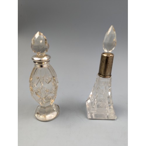 112 - Silver mounted items to include a pair of salts, two scent bottles and a certificate holder