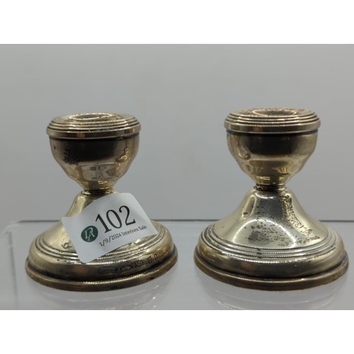 102 - Pair of silver candle sticks hallmarked Birmingham 1977.ht 6cms, loaded weight 190gms... 